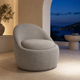 Firenze Curved Boucle Armchair in a Mediterranean blue-hour interior