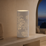 Gia White Porcelain Table Lamp illuminated at blue hour