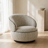 Grazia Cream Boucle Armchair in a minimalist European reading corner