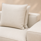 Hudson Haven sofa close-up of flax weave, feather cushions and piped seams