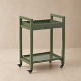 Hudson olive green bar trolley on warm beige Elara studio set
