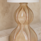 Close-up of the Koda Rattan Lamp glazed base and terracotta linework