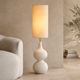 Lido Resin Floor Lamp Natural glowing in a premium Mediterranean living room