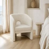 Livenza Cream Fabric Occasional Chair in a bright European coastal bedroom