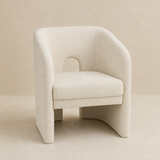 Livenza Cream Fabric Occasional Chair on a warm beige Elara studio background