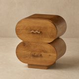 Lugano walnut bedside table with two capsule drawers on a warm beige Elara studio floor