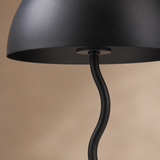 Madison lamp close-up showing satin black metal dome rim and sculptural wavy stem