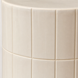 Majolica stool close-up showing ivory glazed ceramic tiles and fine grout joints