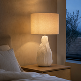 Malmo ceramic lamp glowing in a refined blue-hour bedroom