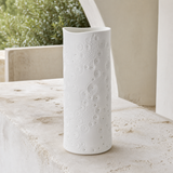 Malmo Small white ceramic luminary from an alternate courtyard angle