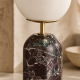 Marino lamp close-up showing claret marble, brass and opal glass