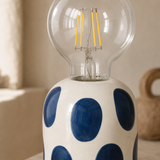 Marley lamp close-up showing handmade ceramic and clear LED globe