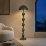 Miami olive floor lamp in a Mediterranean reading room at dusk