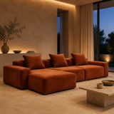 Muse terracotta three-seat chaise in a refined evening interior