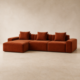 Muse terracotta three-seat chaise in a warm beige Elara studio