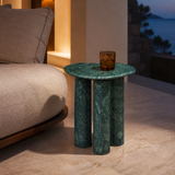 Nettuno green stone side table in an evening Mediterranean interior