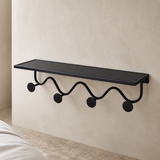 Oriel black metal wall shelf and four-hook rack from an alternate angle