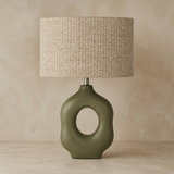 Oslo olive ceramic table lamp studio view on warm beige Elara background