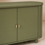 Close-up of Oslo sage green finish and brass handles