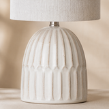 Close-up of Paige ivory ribbed ceramic finish and linen shade