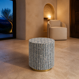 Palermo mosaic cylinder accent stool in a refined evening interior