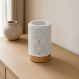 Palm perforated white cylinder lamp from an alternate angle