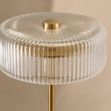 Close-up of Park ribbed glass and brushed brass finishes