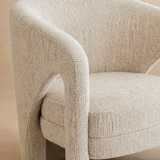 Close-up of Perugia ivory textured upholstery and open arm construction