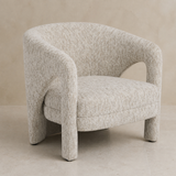 Perugia textured ivory accent chair in a warm beige Elara studio