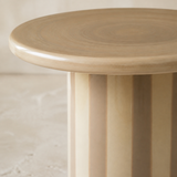 Close-up of Rayas tabletop and striped pedestal finish