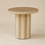 Rayas circular pedestal side table in Elara beige studio