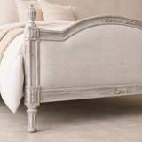 Close-up of Regal Queen Margrethe bed upholstery and carved finish
