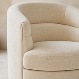 Close-up of Riviera accent chair ivory woven upholstery and rounded construction