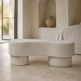 Riviera ivory upholstered bench in a premium Mediterranean bedroom