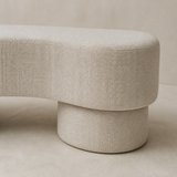 Close-up of Riviera bench ivory woven upholstery and cylindrical pedestal