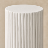 Close-up of the fluted warm white finish of Roma Display Plinth Tall