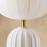 Close-up of Shelton lamp ribbed shade, brass neck and fluted ceramic base