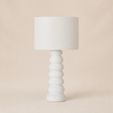 Siena Resin Table Lamp Wht in warm beige studio