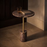 Siena Warm Stone Side Table in an evening European interior