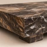 Close-up of Solari brecciated marble slab and block foot