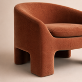 Close-up of Solene rust upholstery, integrated leg and arch