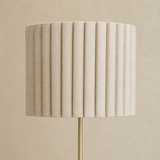 Close-up of the Sombra Gold floor lamp pleated linen shade