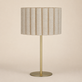 Sombra Gold Natural table lamp in an Elara beige studio