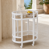 Tesa white and cane bar cart on a Mediterranean courtyard terrace