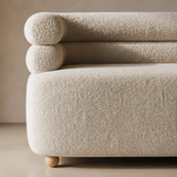 The Althea Loveseat boucle and rounded rail detail