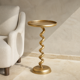Torino twisted iron side table beside a neutral armchair