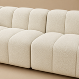 Close-up of the Tribute Shell sofa center join and bouclé channels