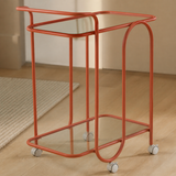 Close-up of the Trinità coral tubular frame and clear glass shelves