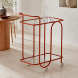 Trinità coral metal and glass trolley in a Mediterranean dining room