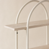 Close-up of Umbria pale wood shelf and ivory arched metal frame